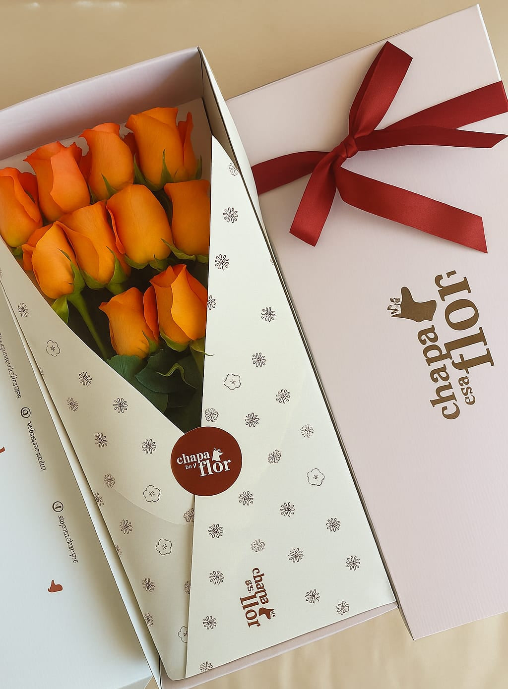 Box Premium con 12 rosas naranjas